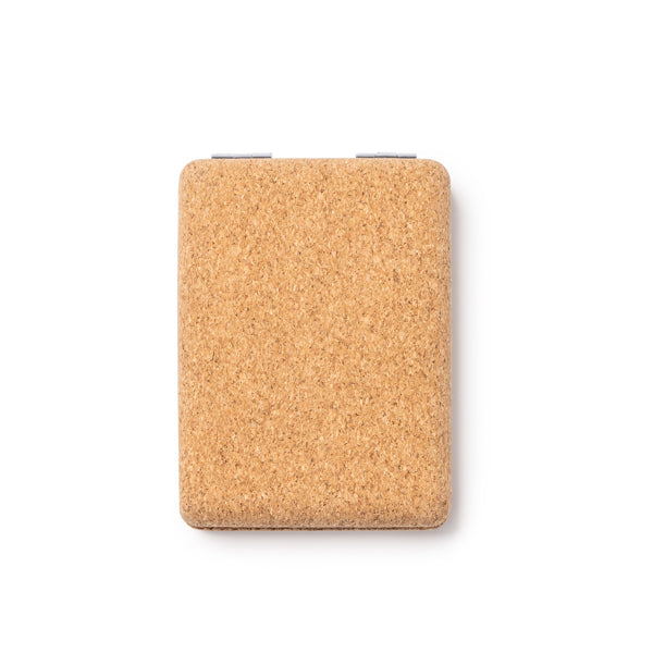 The folding pocket mirror in natural cork with chromed metal finishes is an elegant and sustainable option to always carry with you